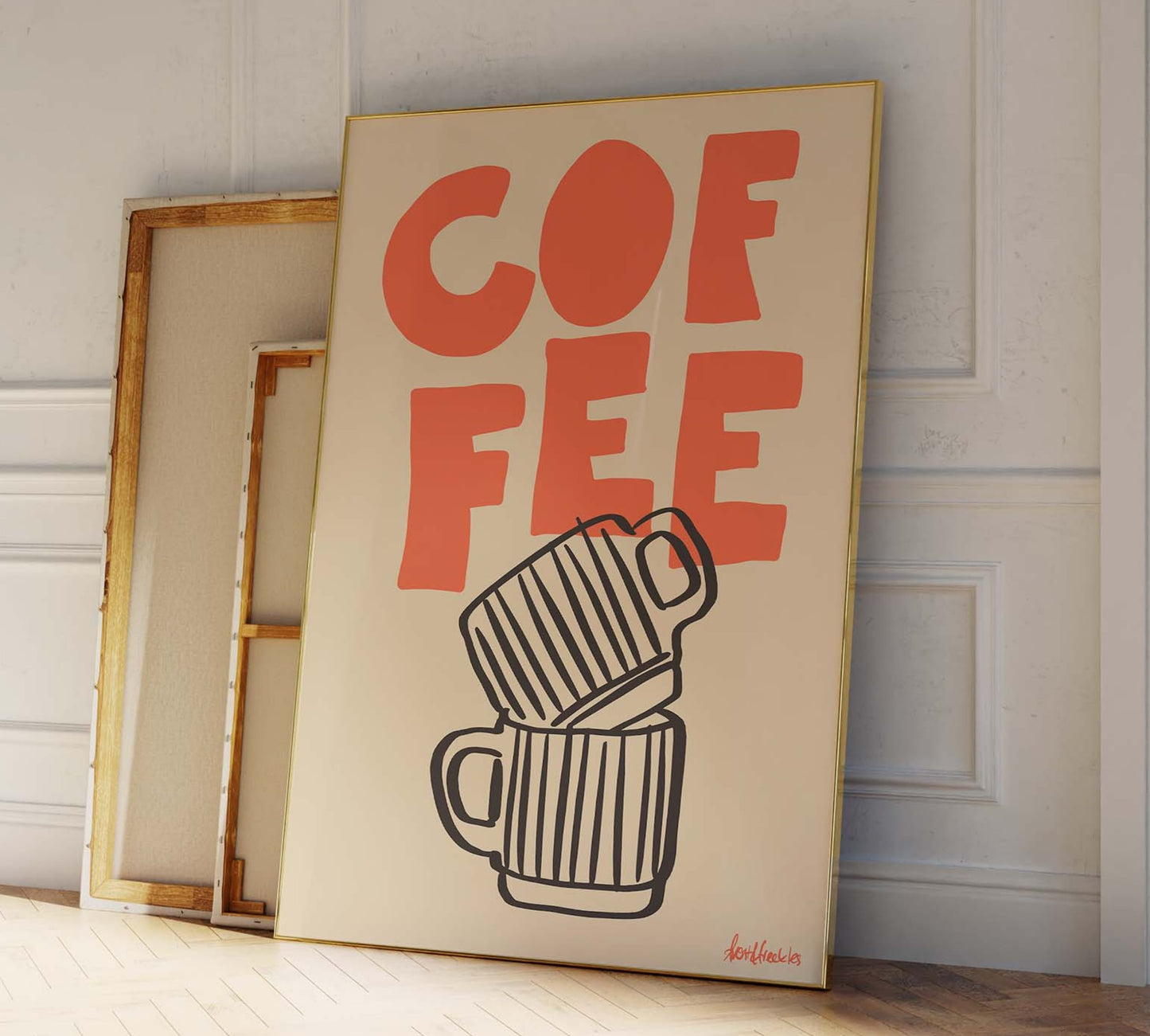 Framed coffee poster as part of a gallery wall with neutral decor in hallway