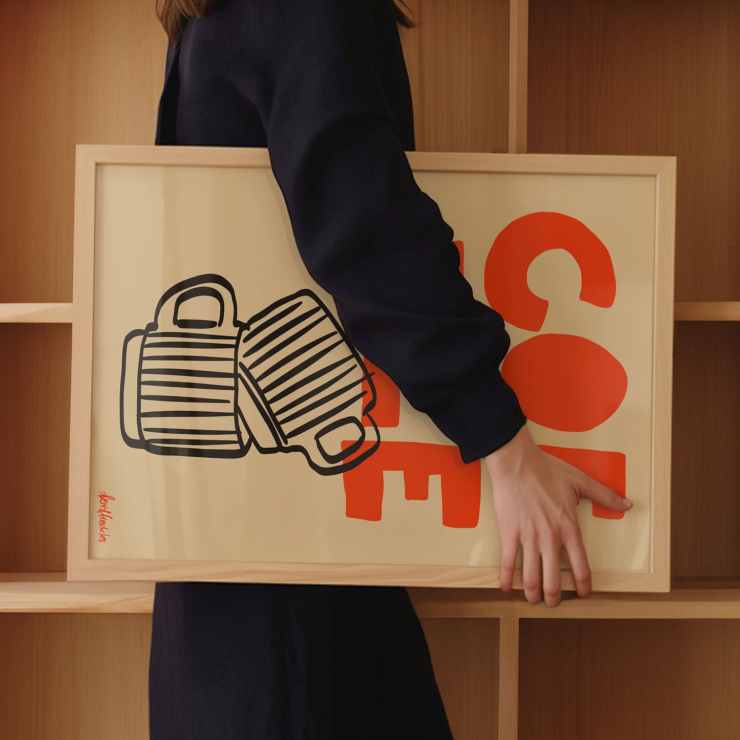 Woman holding framed Scandinavian coffee print in cozy home coffee station