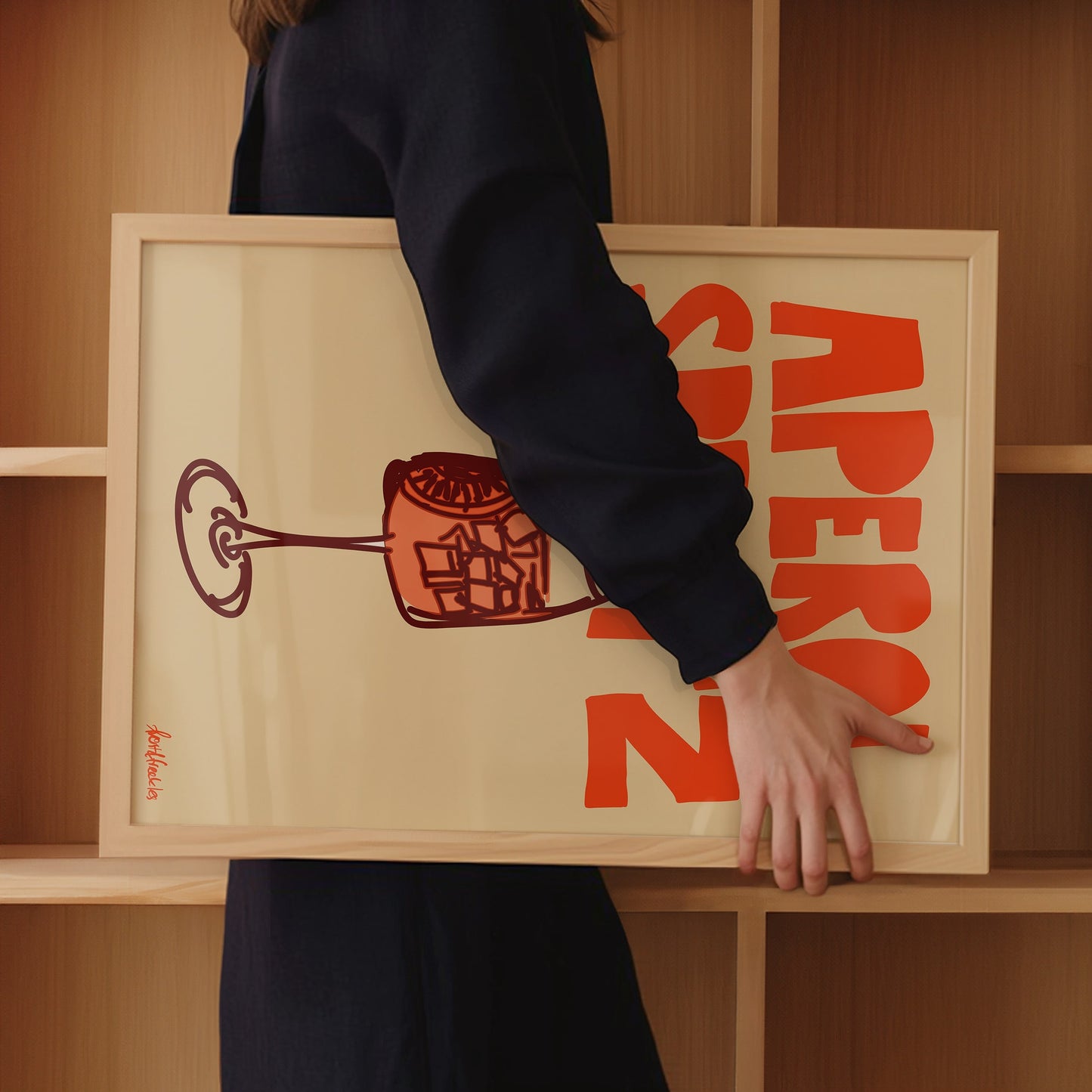 Close-up of hand-drawn Aperol Spritz print showing cocktail glass and bold orange text