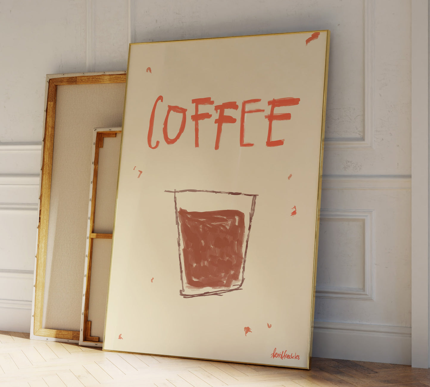 Coffee themed wall art print framed and leaning against kitchen wall, warm neutral décor for home coffee bar.