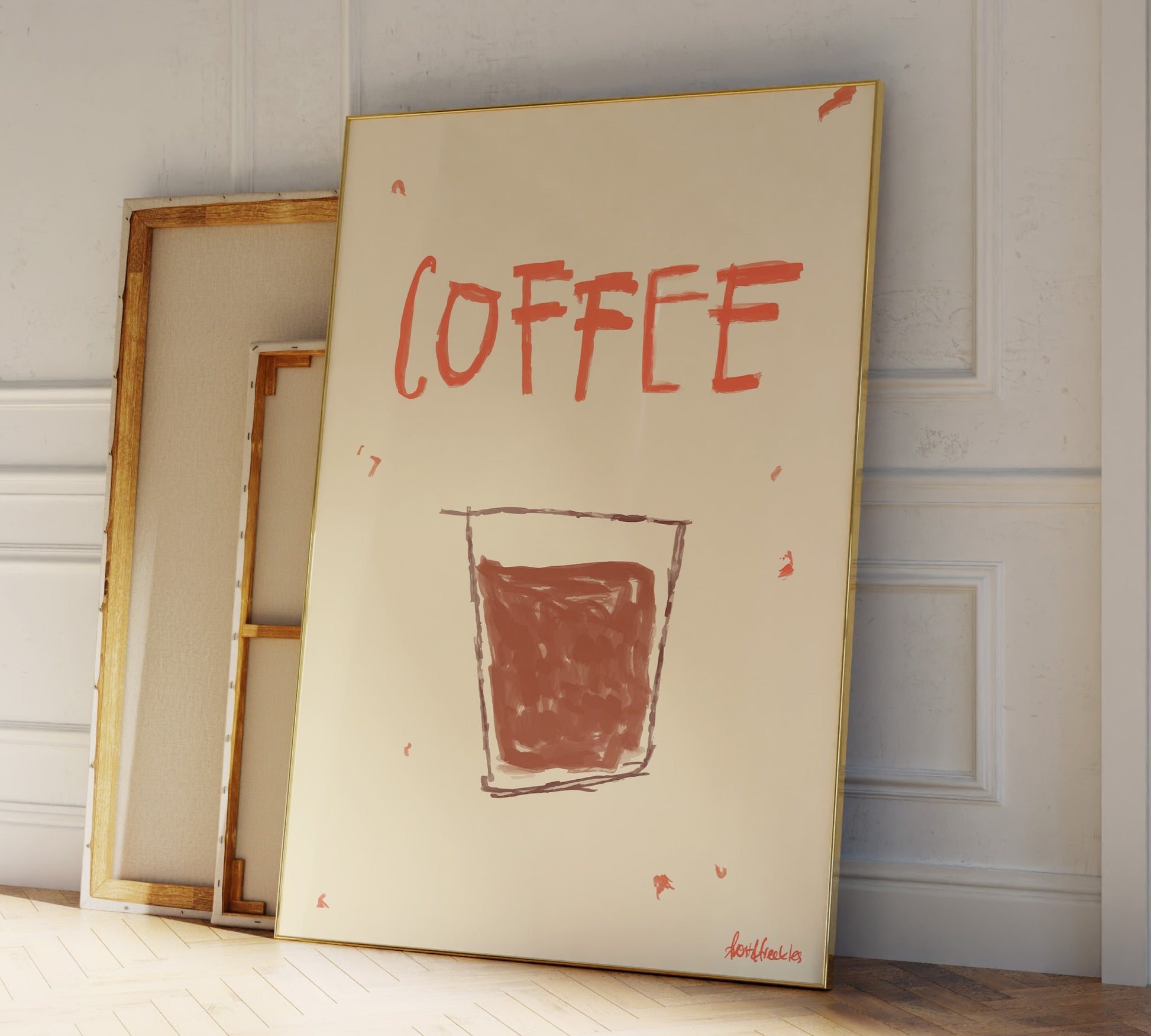 Coffee themed wall art print framed and leaning against kitchen wall, warm neutral décor for home coffee bar.