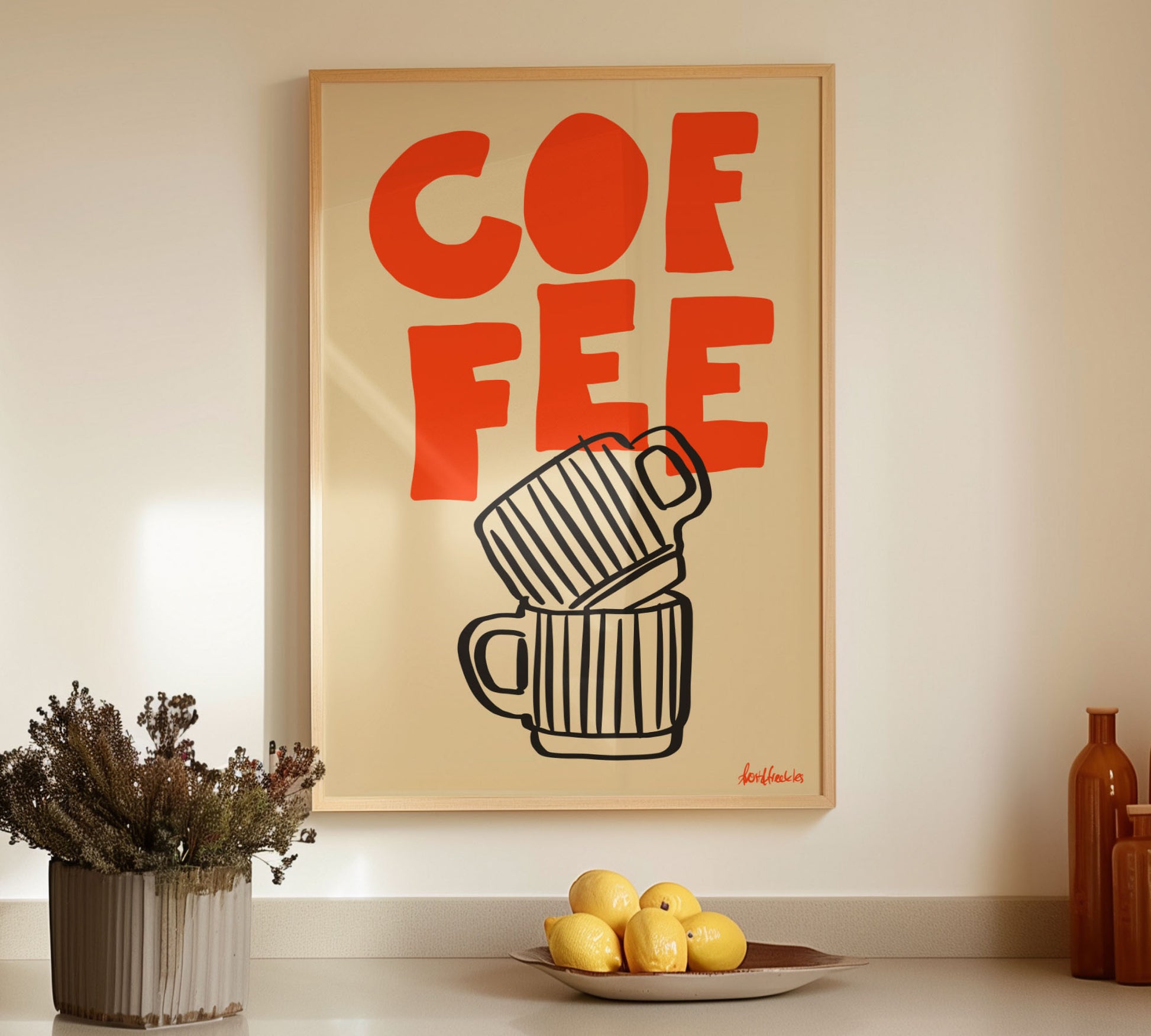 Framed coffee print hanging above counter with lemons and bottles