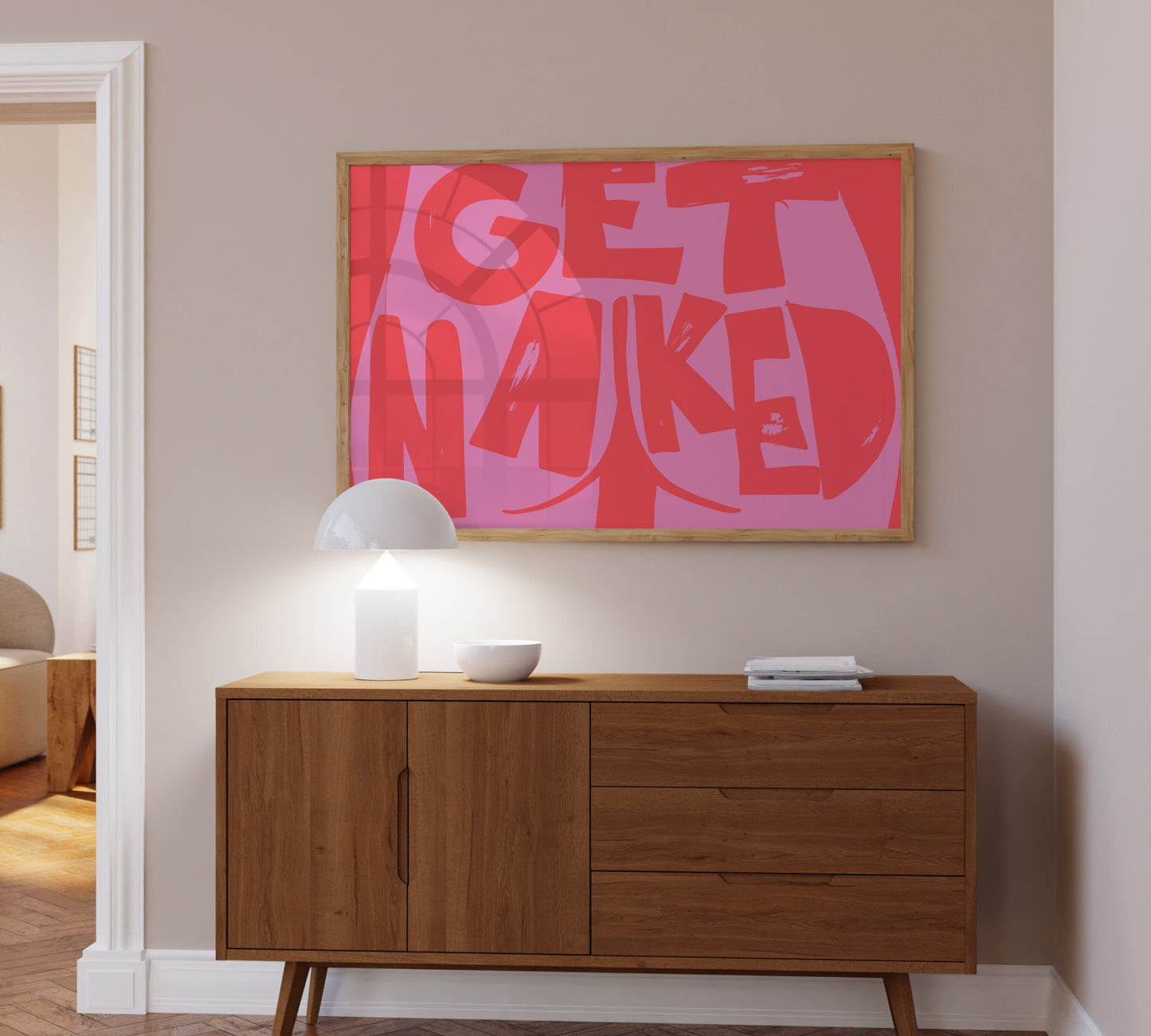 Cheeky "Get Naked" poster with butt cheek illustration, red and pink colors.