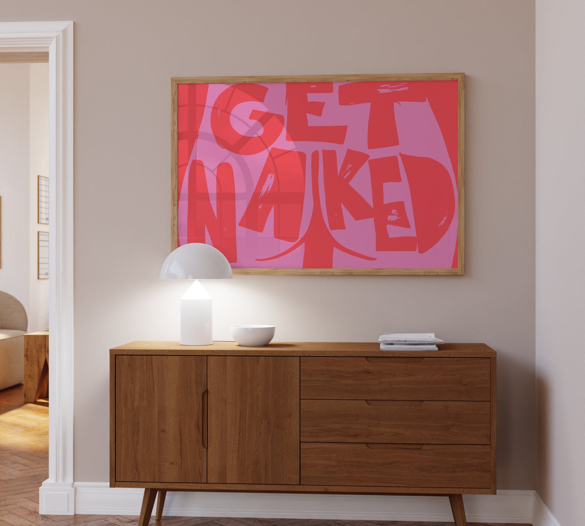 Cheeky "Get Naked" poster with butt cheek illustration, red and pink colors.