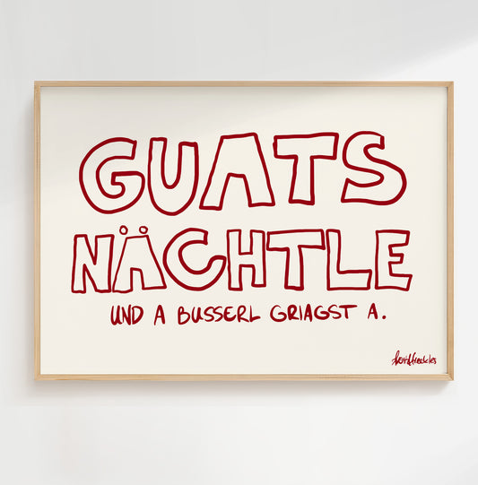 Gerahmtes "Guats Nächtle" Poster über dem Bett im gemütlich dekorierten Hotel Schlafzimmer.