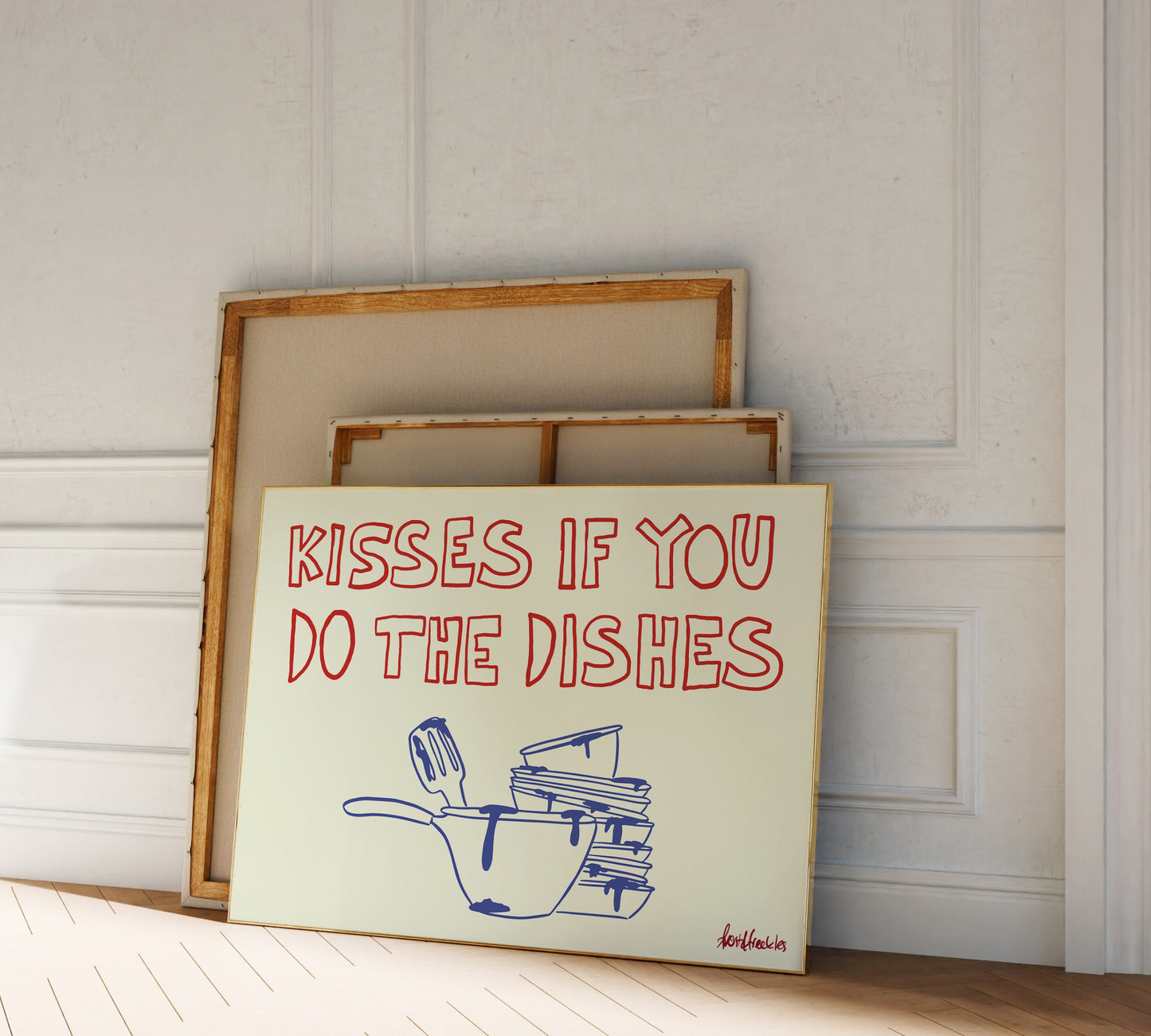 Modern kitchen decor featuring flirty dishwashing reminder, framed print leaning against wall in a cozy home setting