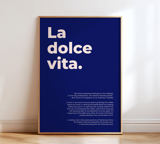Minimalist typography poster featuring the text "La dolce vita" and an English definition in cream-white on a deep blue background