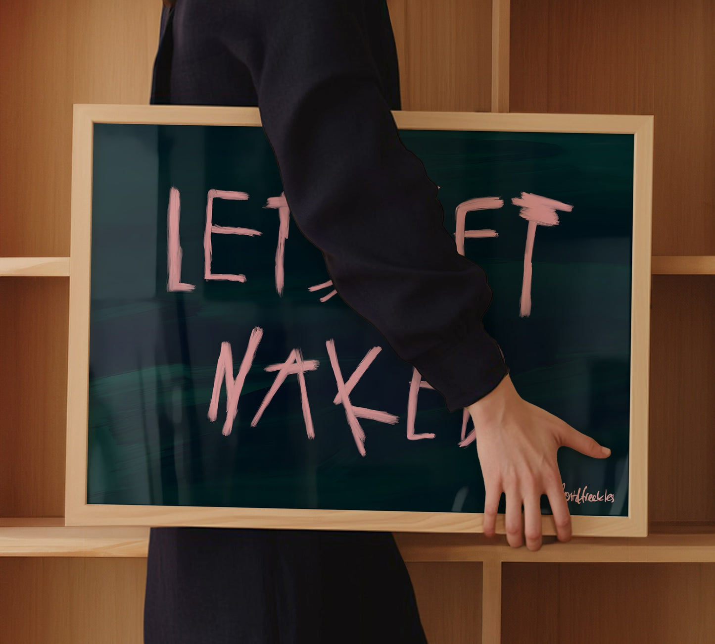 Cheeky bathroom wall art reading "Let's Get Naked", paired with minimalist wooden decor