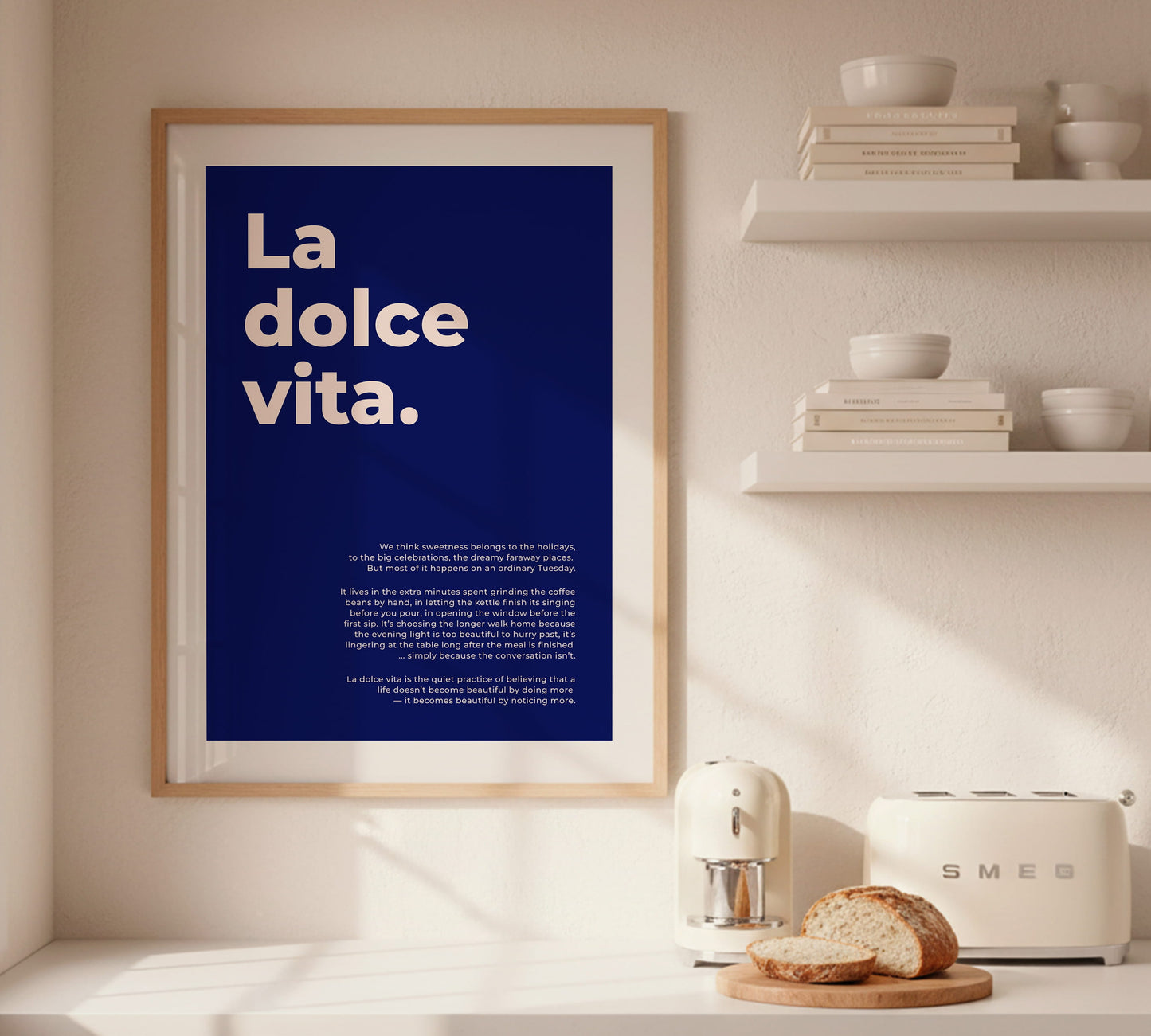 Stylish blue and white graphic poster with the slogan "La dolce vita" in a Mediterranean theme for a summer-inspired gallery wall setup.