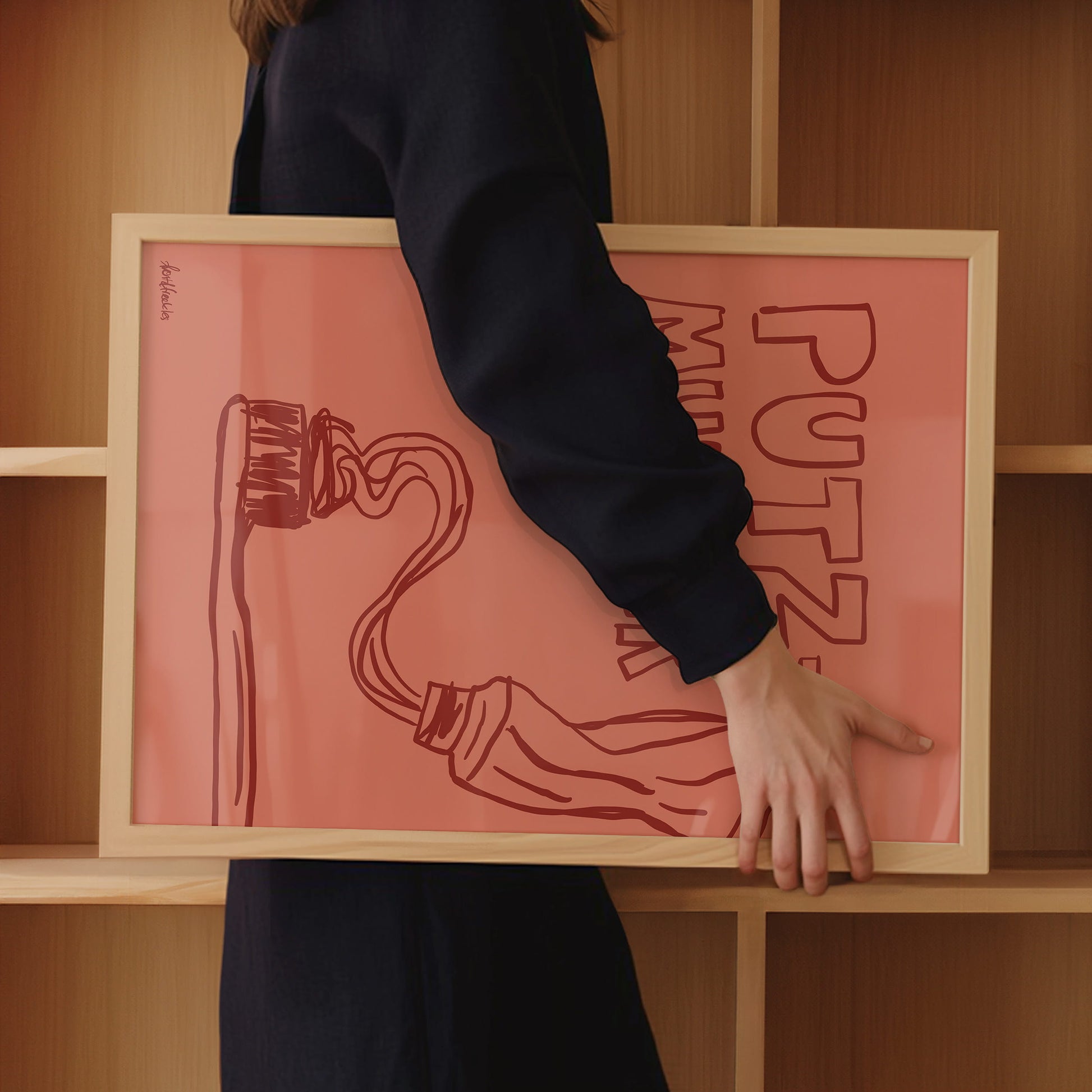 Stilvolle Badezimmer Deko mit Illustration von Zahnbürste und Zahnpasta sowie dem Text "Putzmunter"