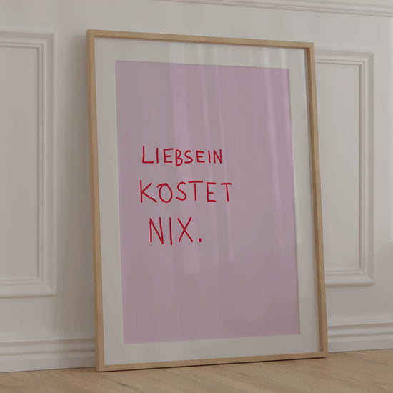 Modernes Poster in Handschrift, rote Schrift auf pinkem Hintergrund, gerahmt