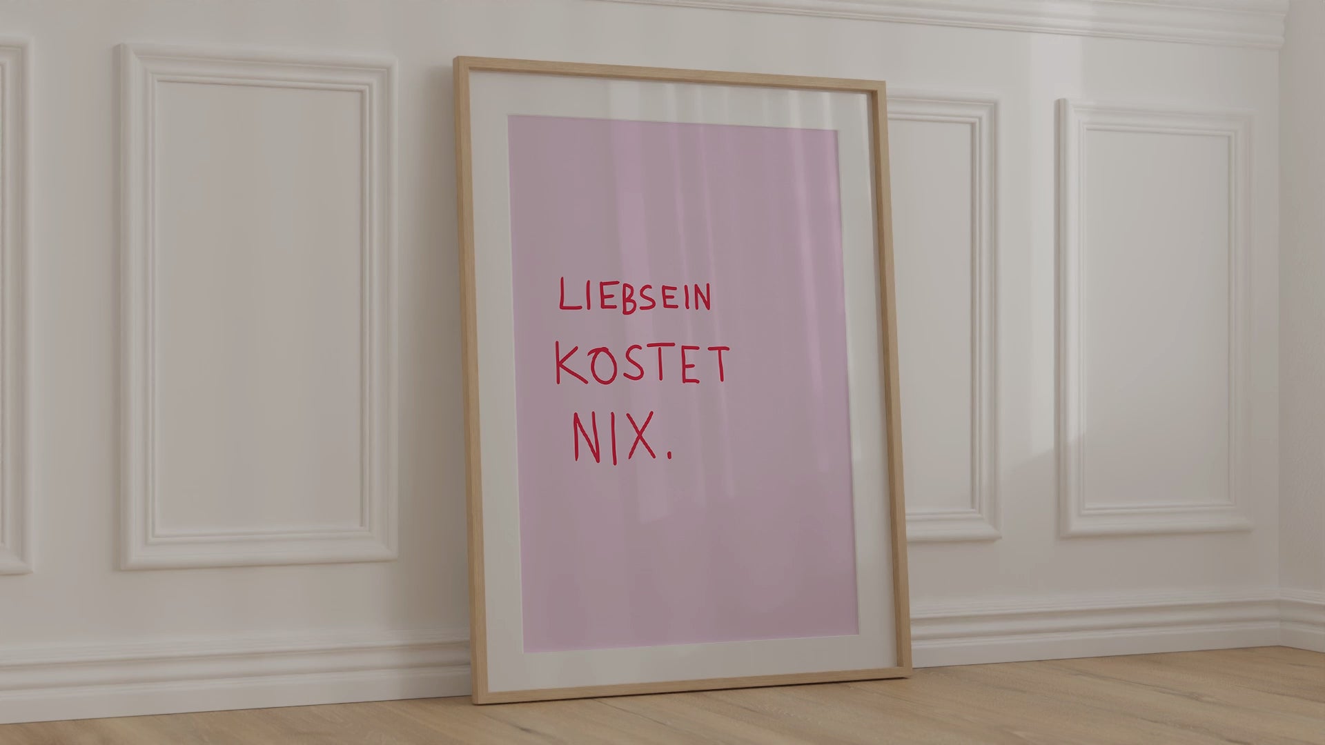 Modernes Poster in Handschrift, rote Schrift auf pinkem Hintergrund, gerahmt