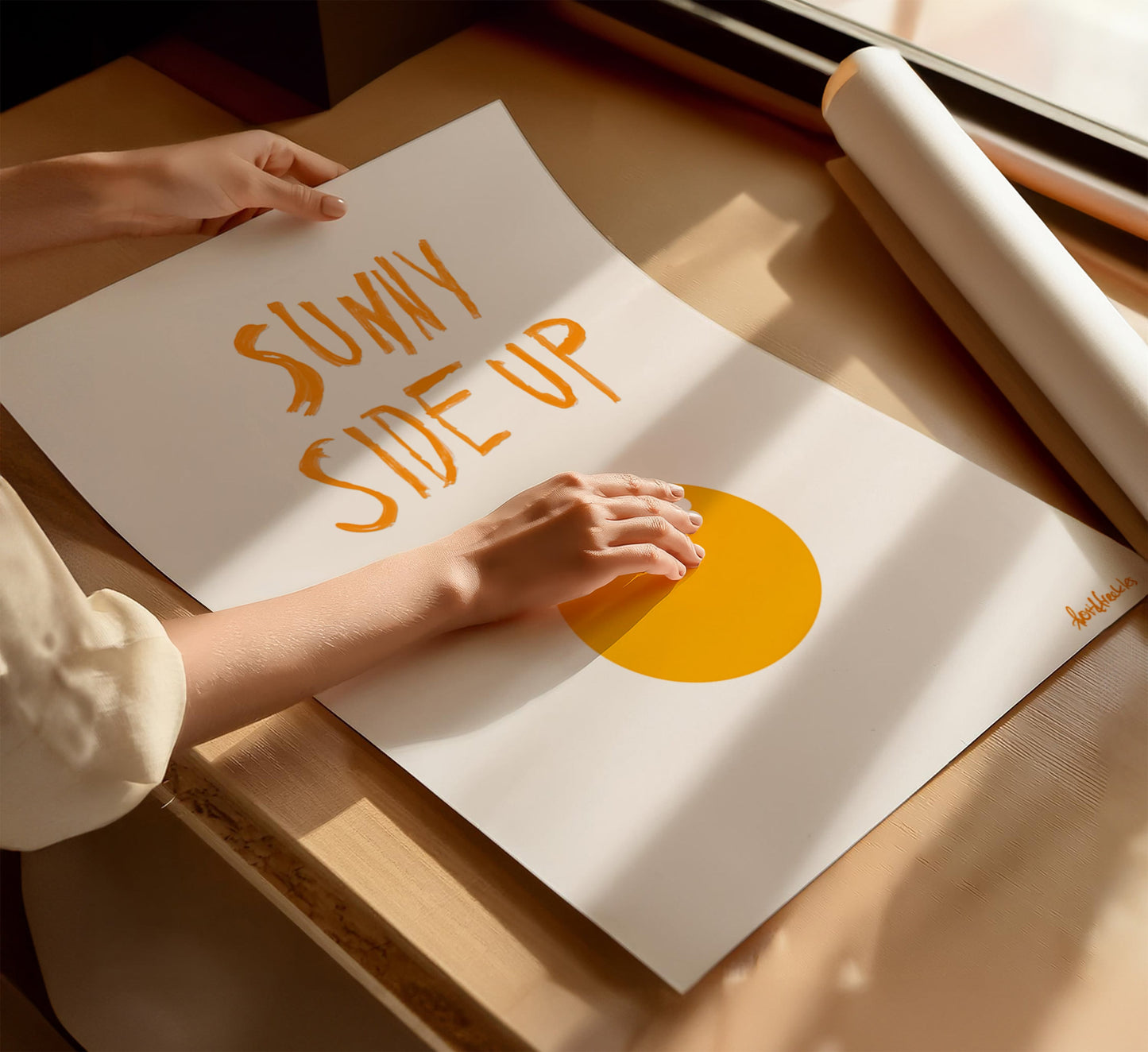 Modern Sunny Side Up wall art print laid out flat on kitchen table, displayed in cozy kitchen with natural light.
